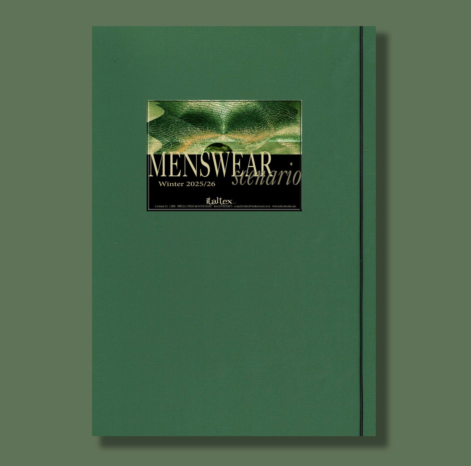 The cover of the Italtex Menswear Scenatio book AW 25/26 is a dark green folder with Menswear Scenario Autumn/Winter 2025/26 written in white on an abstract design background